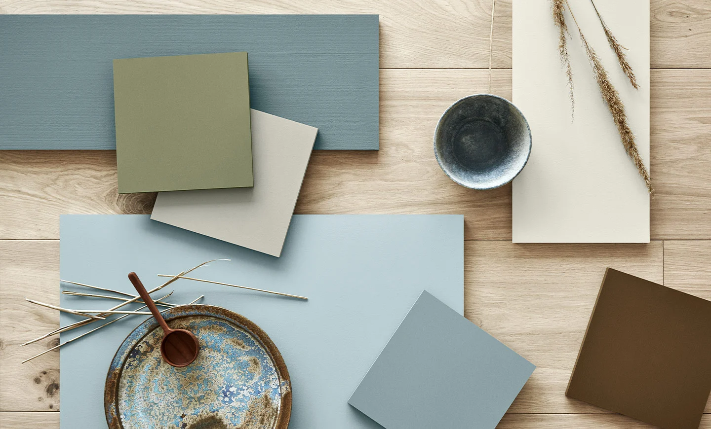 Jotun colour samples in blue, green, beige and brown tones