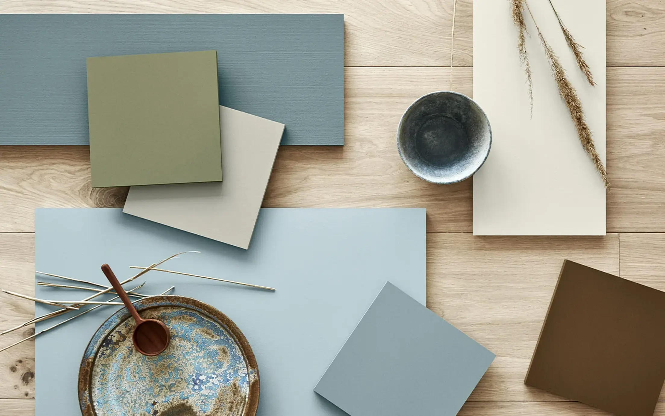 Jotun colour samples in blue, green, beige and brown tones