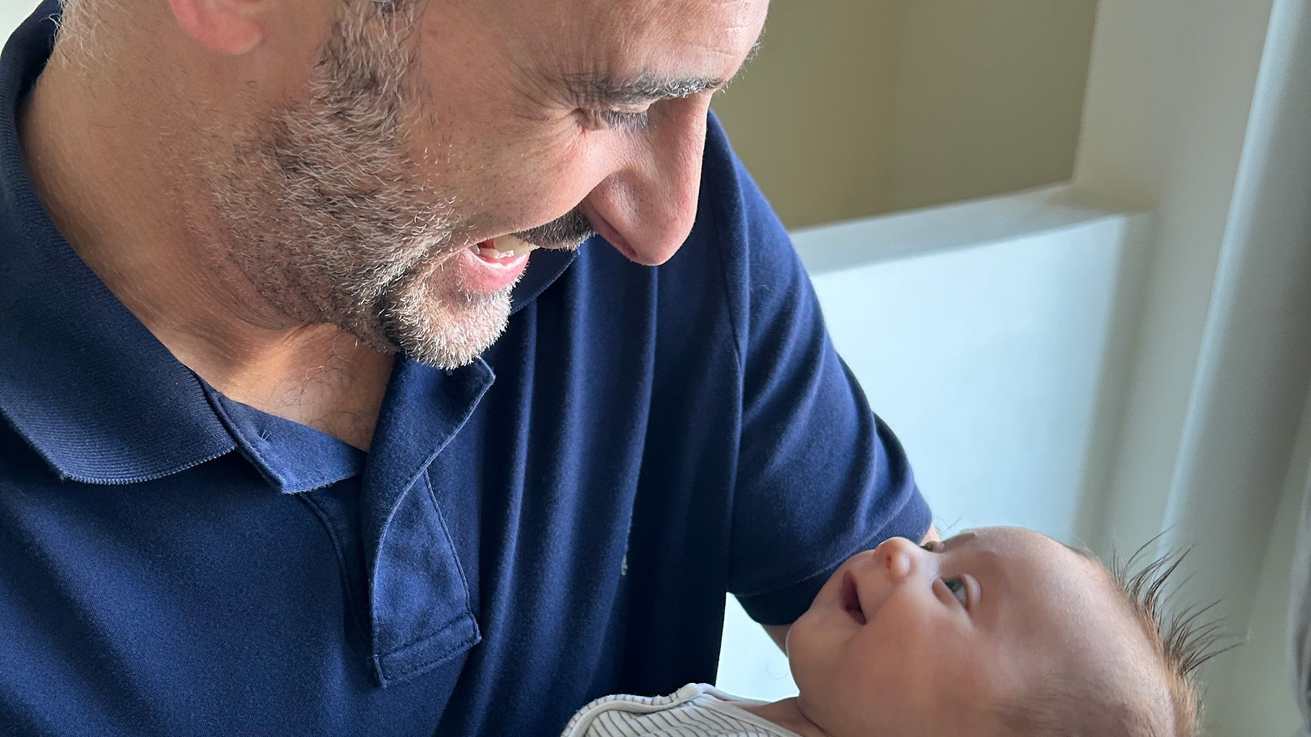 Smiling father with happy baby