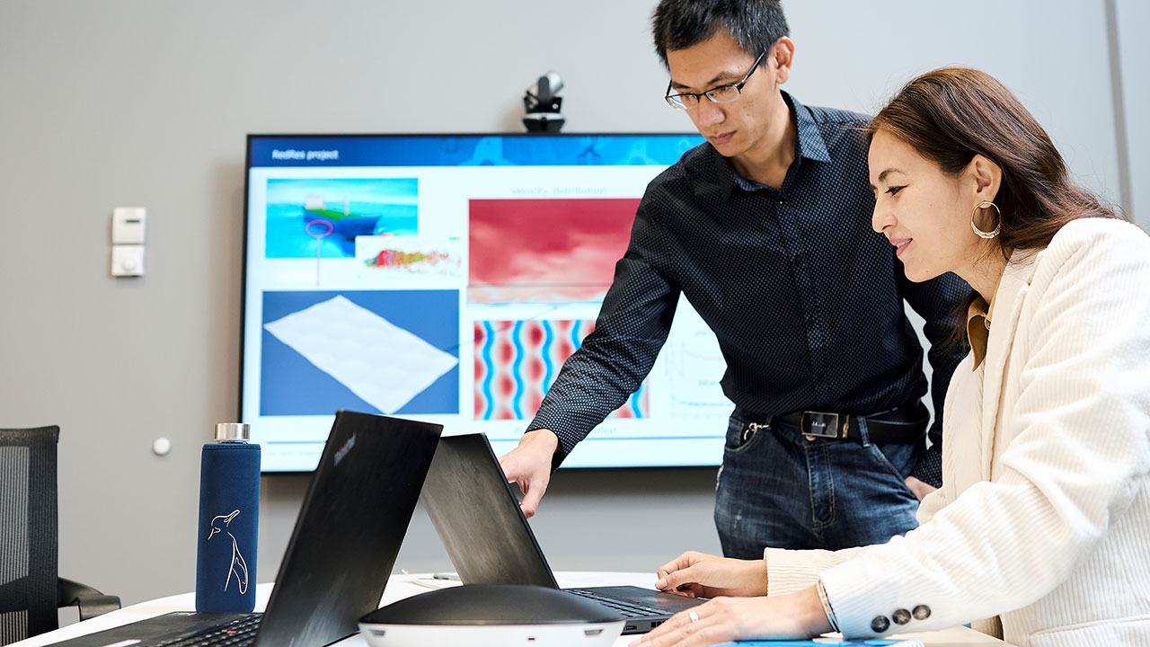 Coworkers helping each other. 